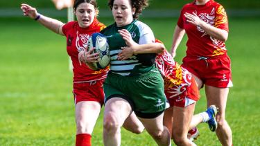 Girls playing rugby