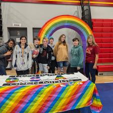 Group of students in front of their club fair table